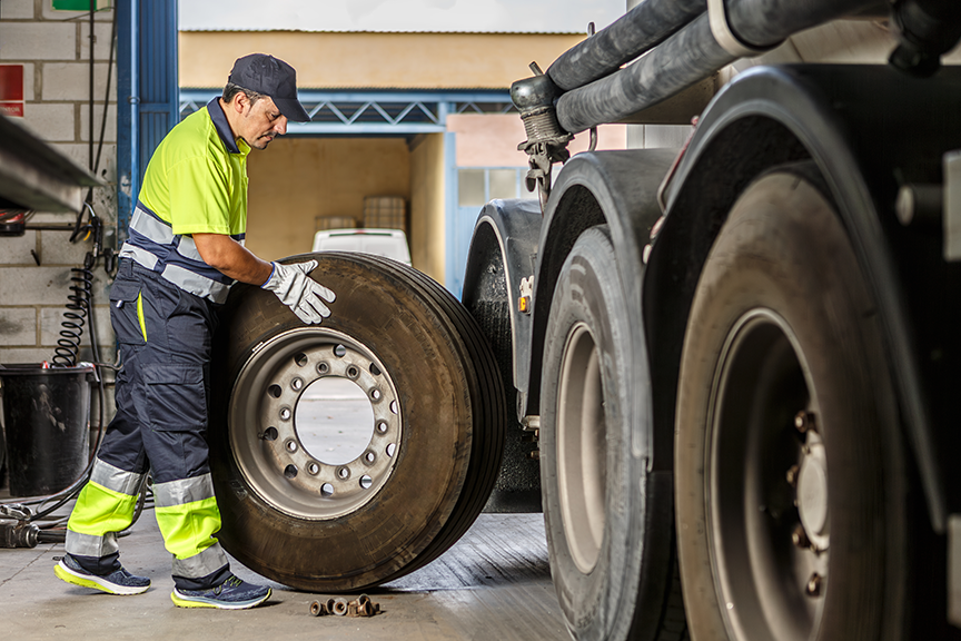 automotive technician replacing tires