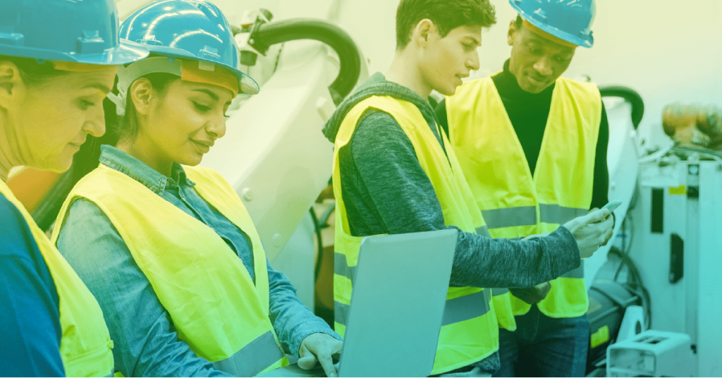 Maintenance techs looking at a laptop with CMMShere open