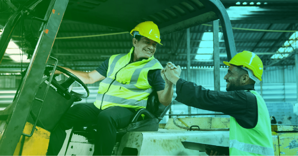 Maintenance technicians shaking hands happy because the company decided to get CMMShere